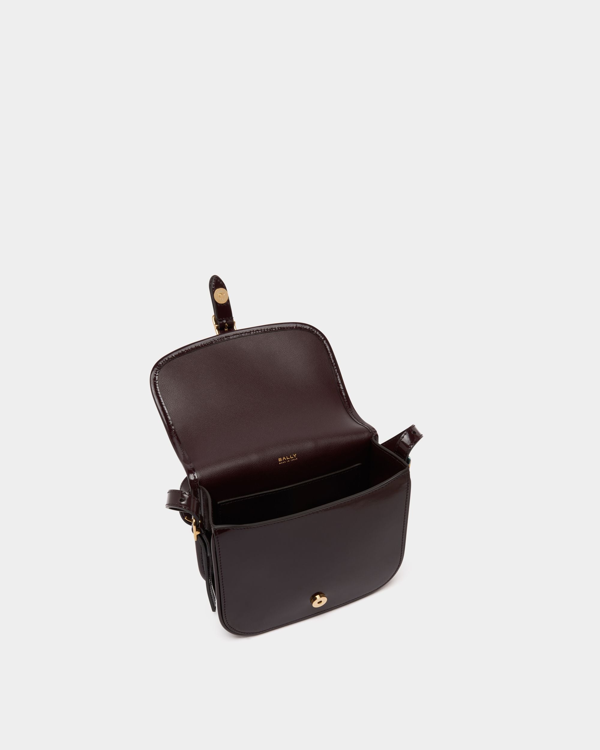 Beckett Small Crossbody Bag in Deep Burgundy Brushed Leather With a Bally Ribbon - Image 4